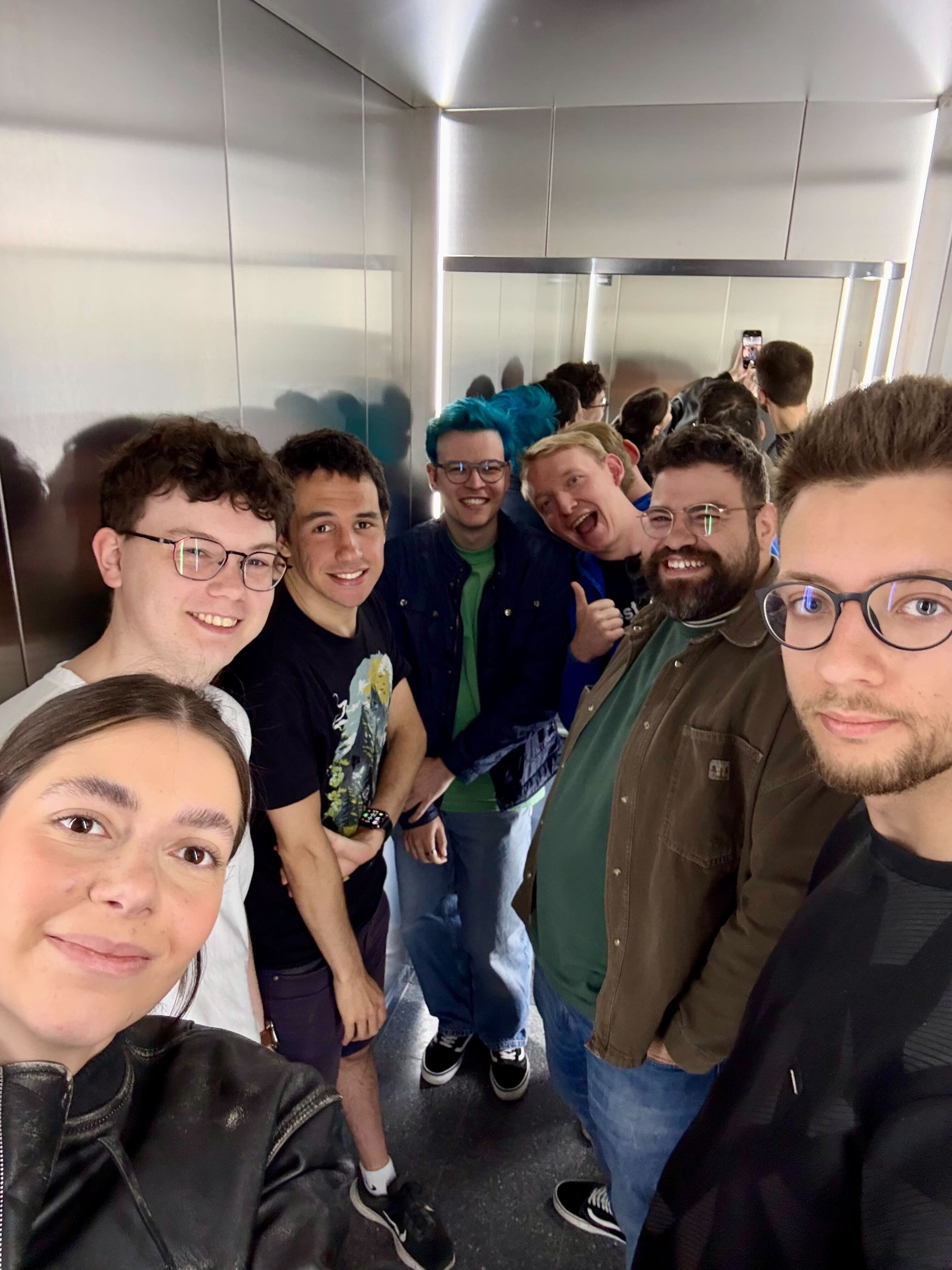 Namespace Labs team in an elevator, May 2026